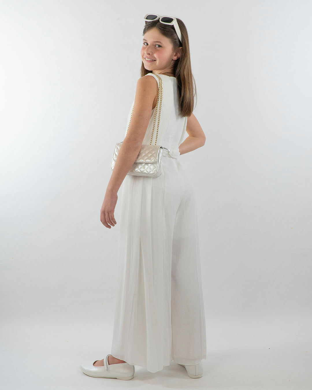 Tuta elegante smanicata con inserti plissè