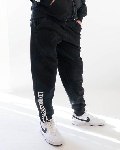 Pantaloni felpati con scritta sulla gamba FKM